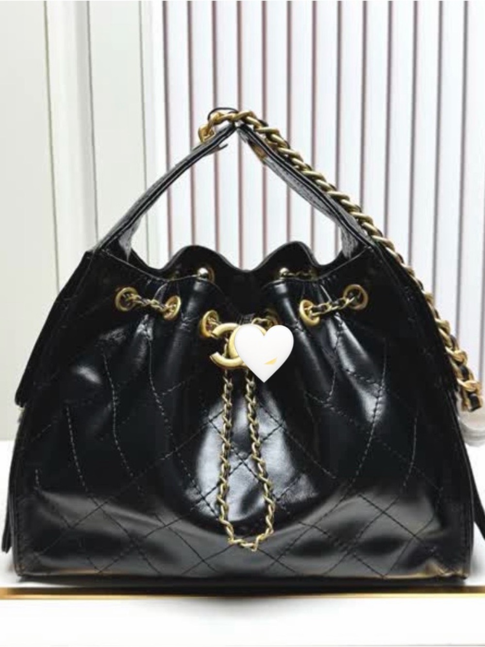 Black Quilted Drawstring Shoulder Bag with Gold Chain